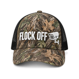 Flock Off camo trucker hat, front: FLOCK OFF in white 3D puff embroidery with an embroidered surveillance camera