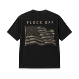 Flock Off Tee in washed black, back: FLOCK OFF above a large waving American flag in muted tan