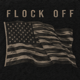 Close-up of the FLOCK OFF and waving flag back print on the black tee